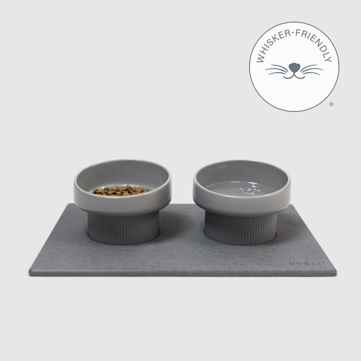 Elevated Cat Feeding Station with food and water on quick-drying stone mat on white background | Whisker-Friendly