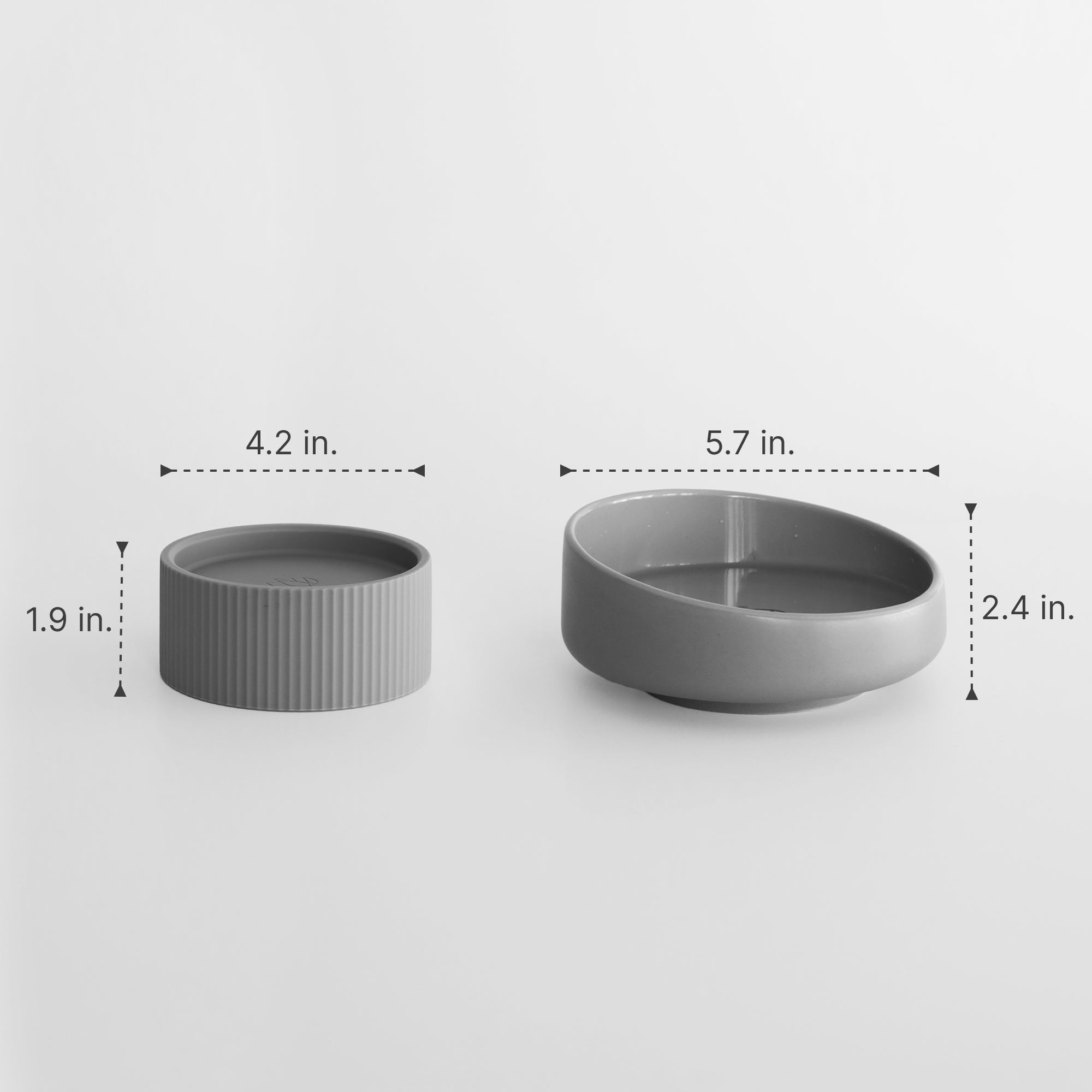 Two gray ceramic bowls with measurements on a white background