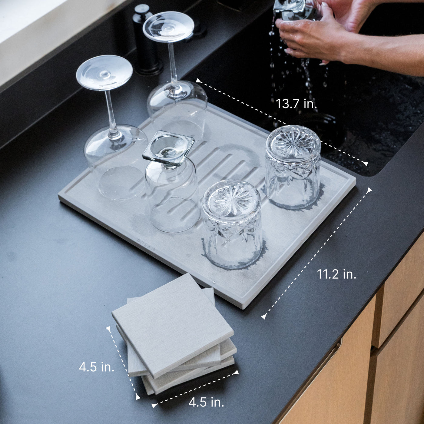 Modern bar set with dishes drying and 4 coasters. 