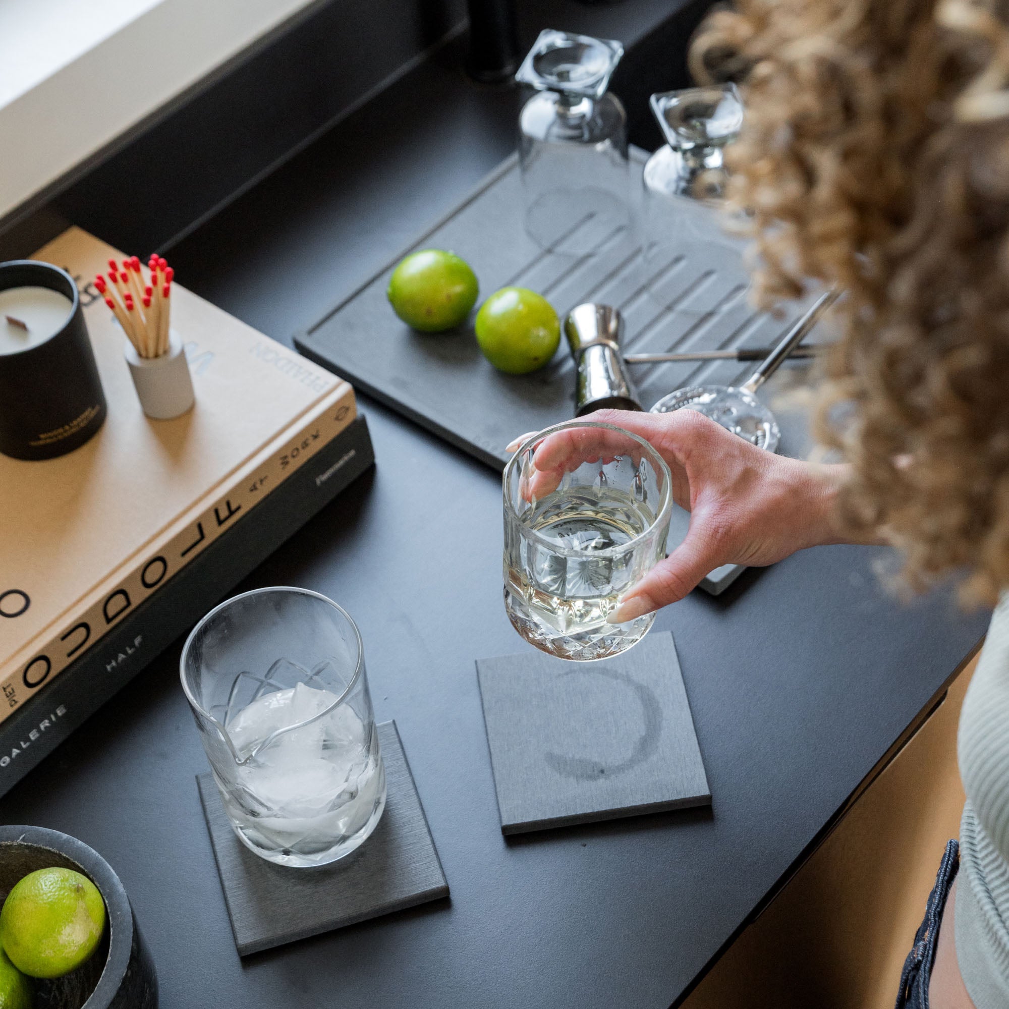 Modern Bar Set with glass on coaster and water ring disappearing. 