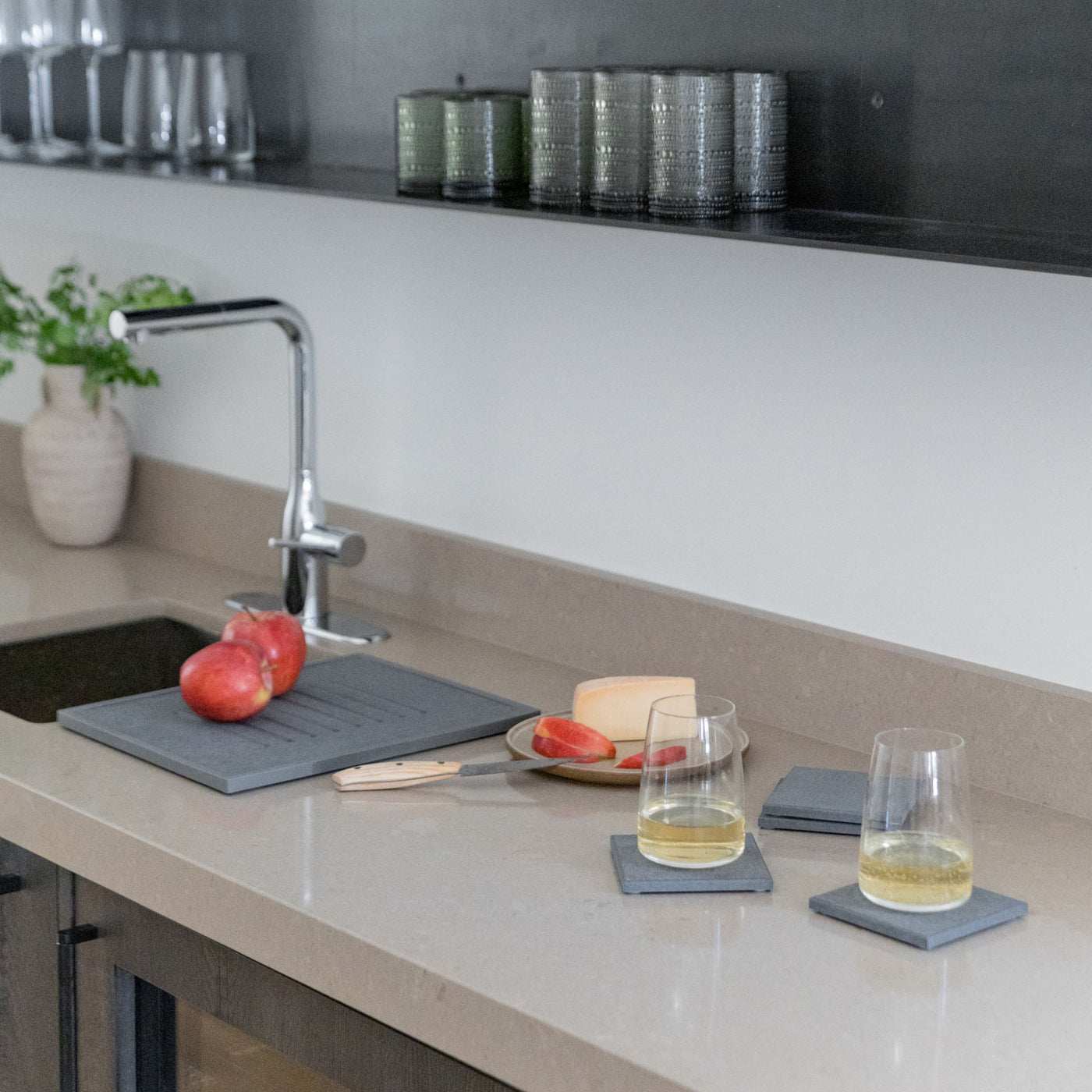Modern kitchen with bar set and wine and cheese. 
