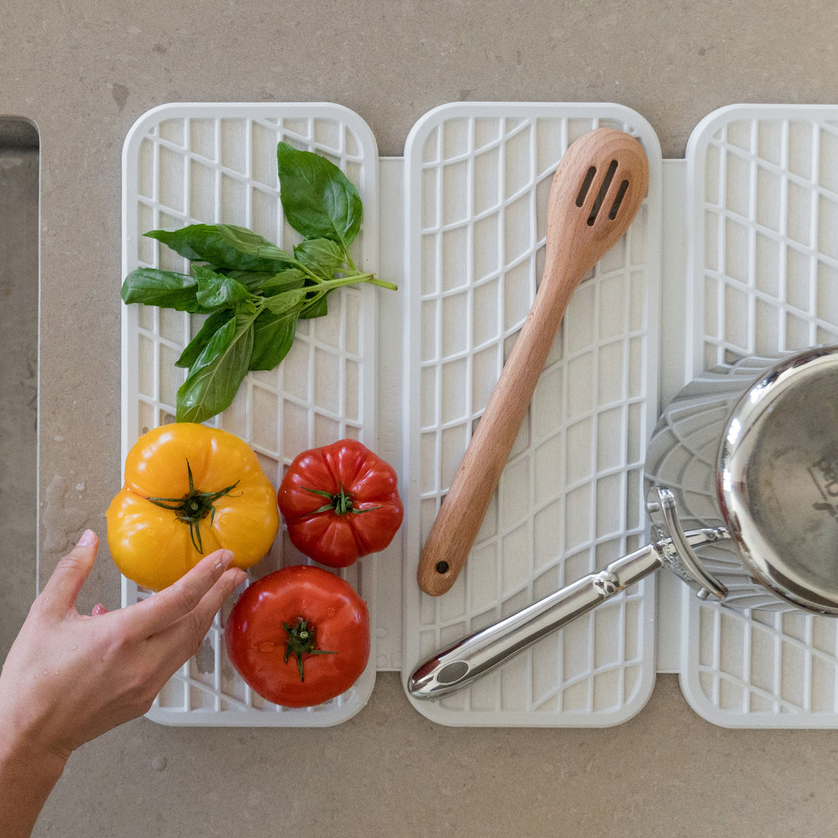 Glacier Dish Pad with Glacier Dish Pad Rack in clean kitchen with dry dishes and produce. 