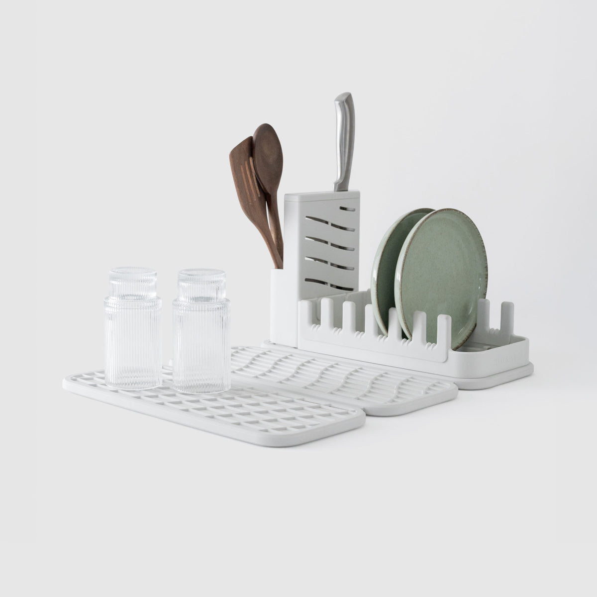 Glacier Dish Pad with Glacier Dish Pad Rack on white background with dishes. 