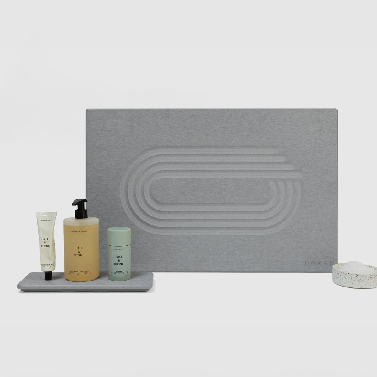Ash Current Bath Stone Mat and Ash Stone Sink Caddy on white background. 