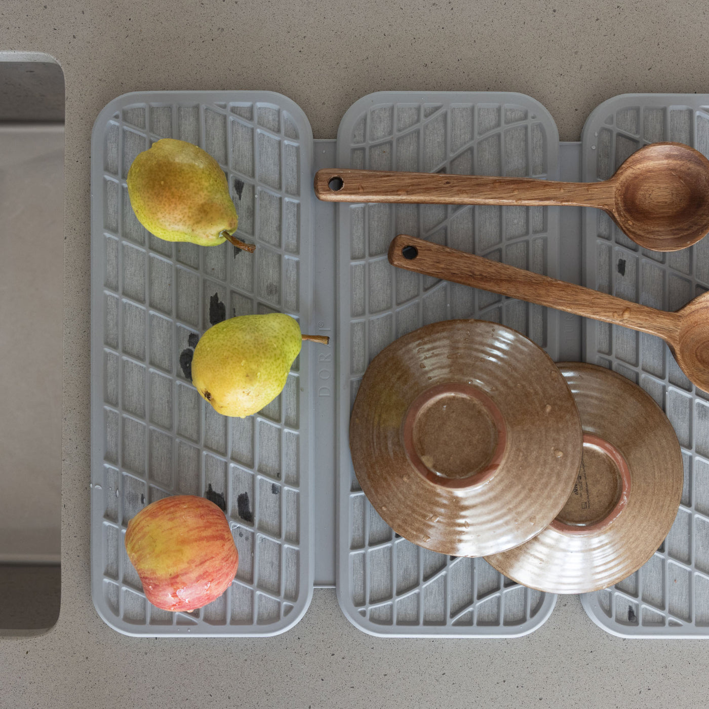 Ash Dish Pad with produce and modern dishes. 