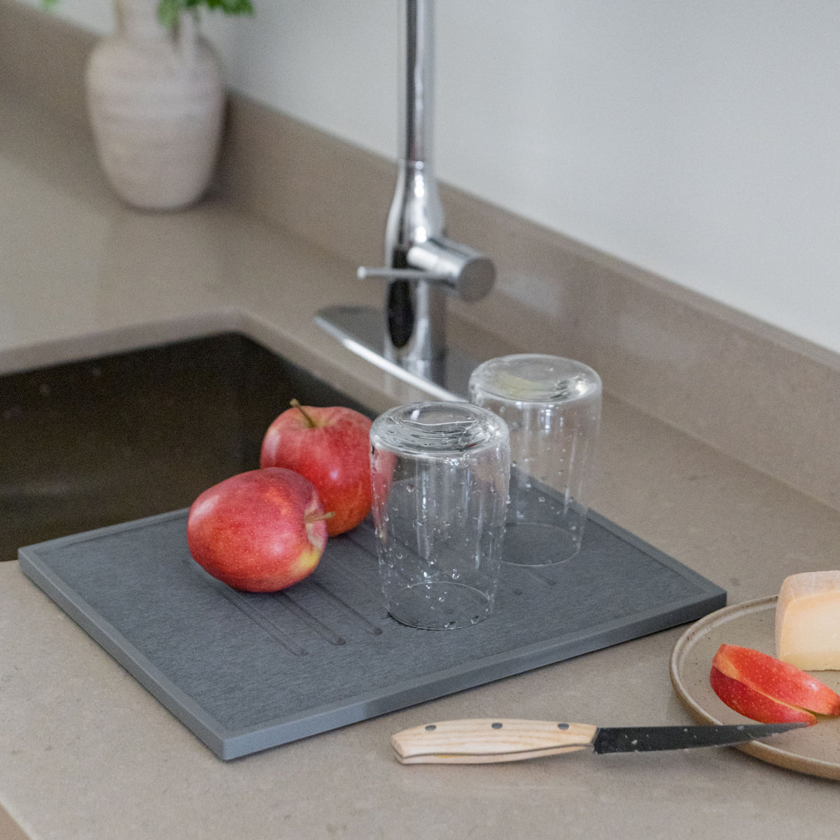 Dishes quickly dry on Slate dish drying mat. 