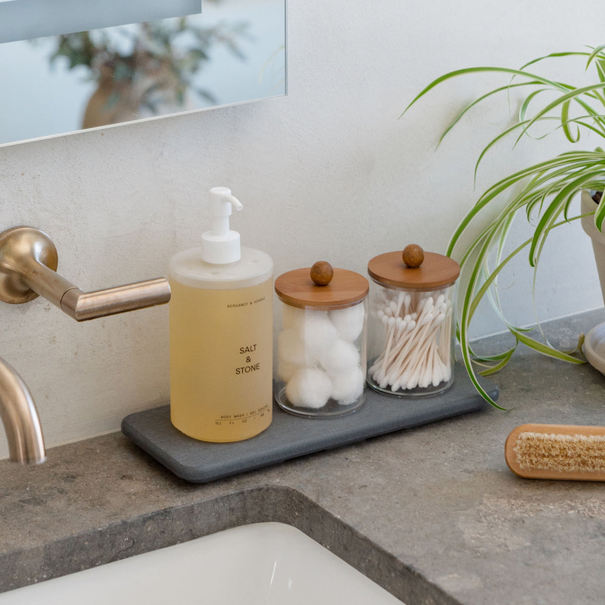 Slate Stone Sink Caddy holds soap, Q-tips, and cotton balls.