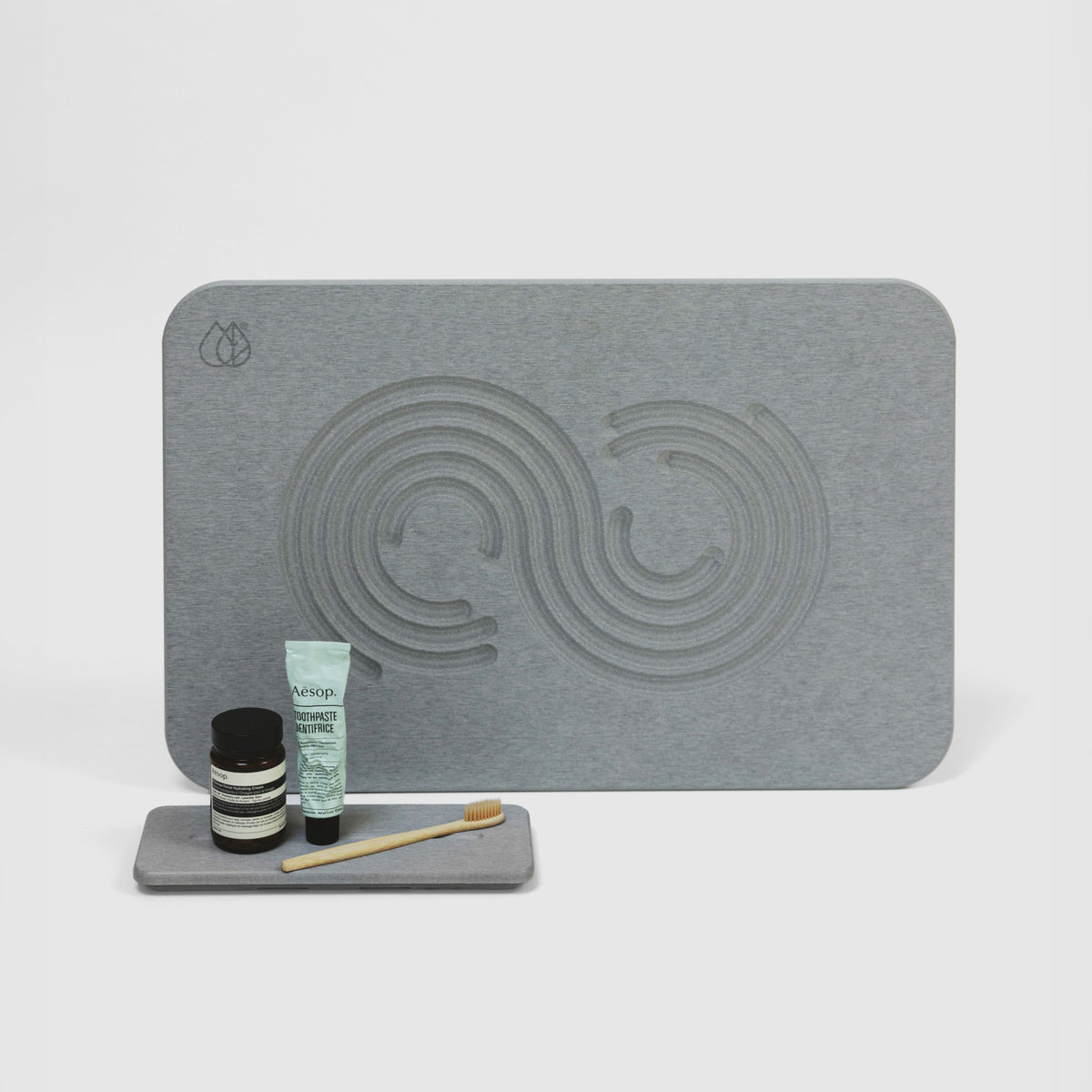 Ash Zen Bath Stone Mat and Ash Stone Sink Caddy on white background. 