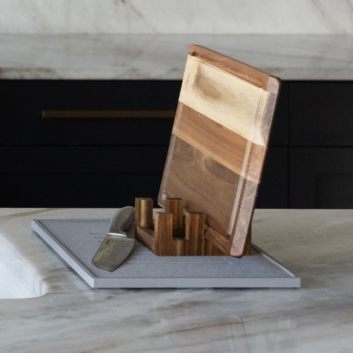 Acacia Cutting Board Holder on Ash Dish Drying Stone with cutting boards and knives.