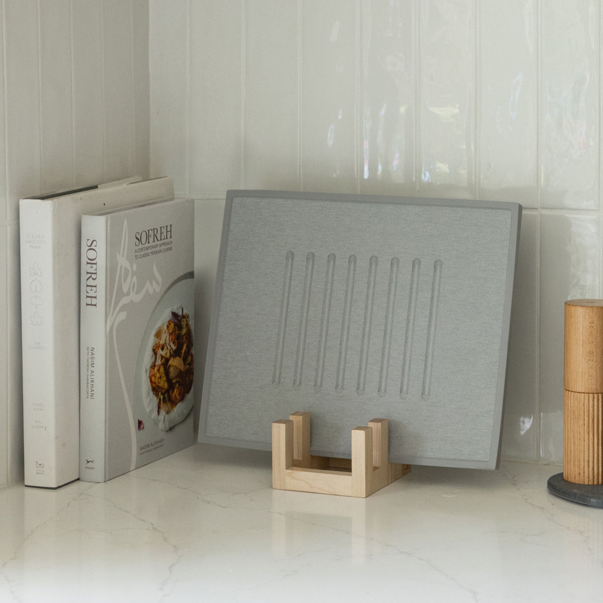 Maple Cutting Board Holder can hold Ash Dish Drying Stone and nestle in with cookbooks.