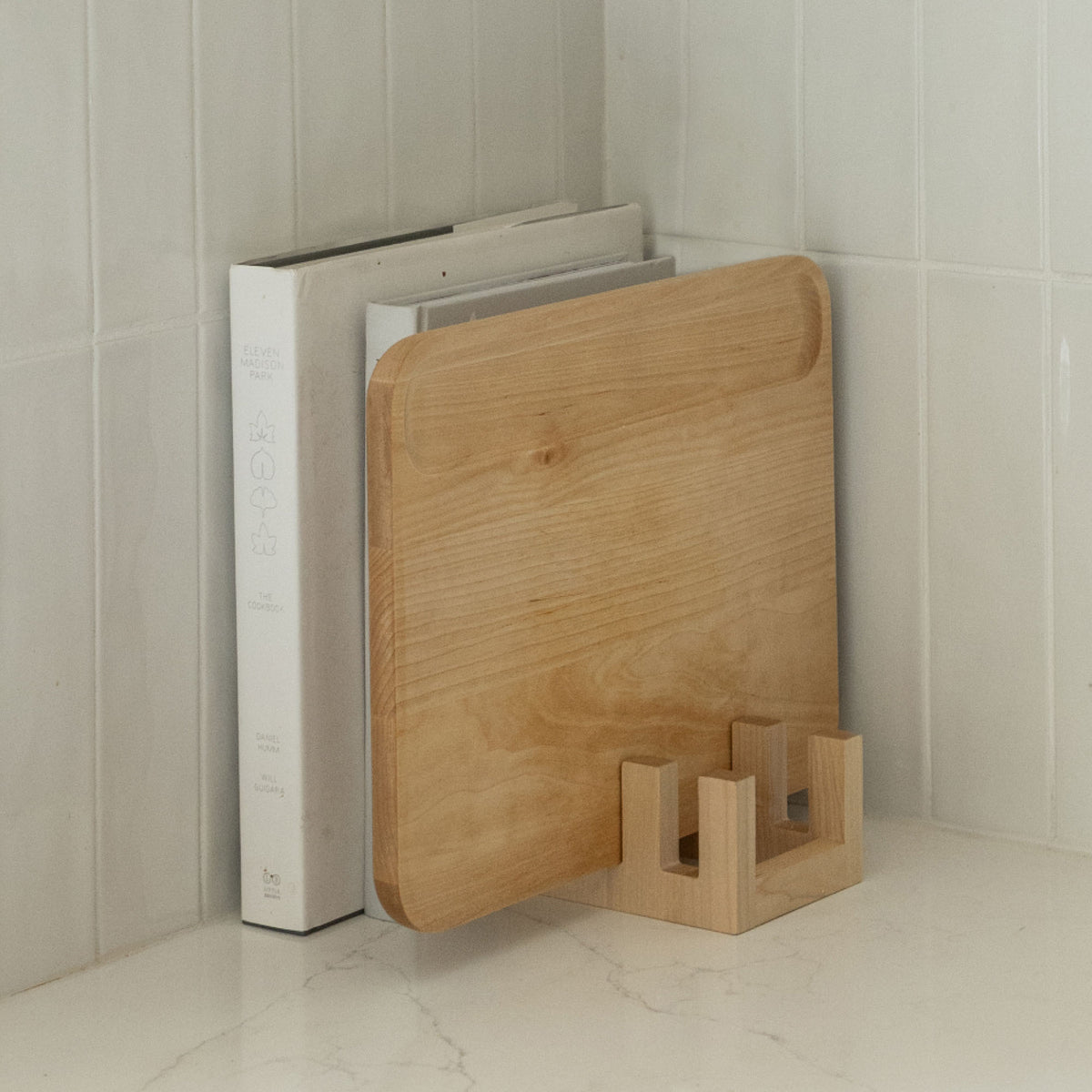Maple Cutting Board Holder can hold Slate Dish Drying Stone and nestle in with cookbooks.