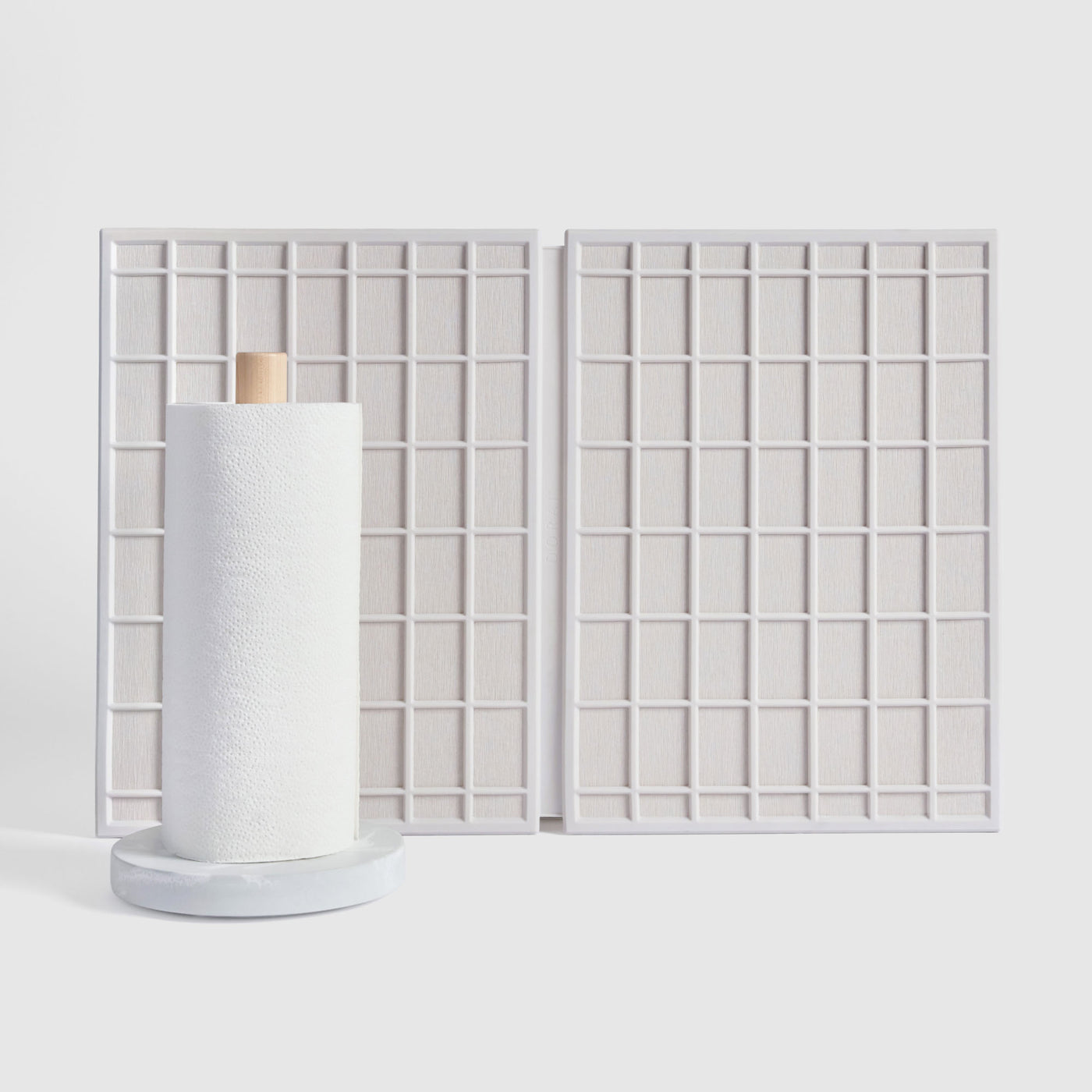 Large Ridge Dish Pad in Glacier and Glacier Paper Towel Holder on white background.