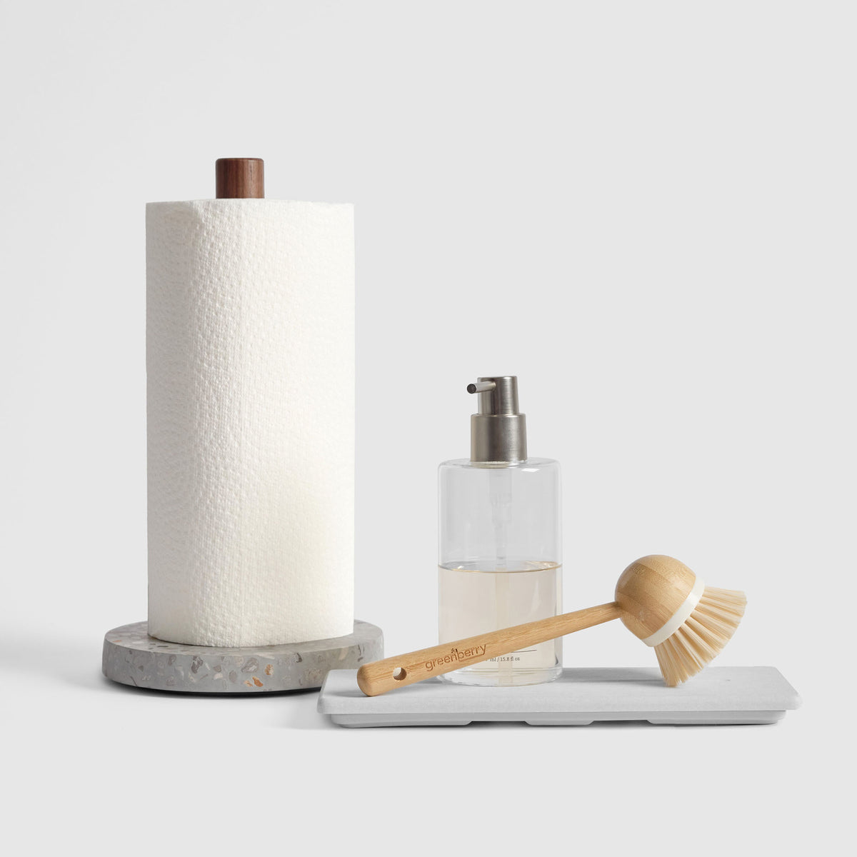 Basalt Paper Towel Holder and Glacier Stone Sink Caddy on white background.