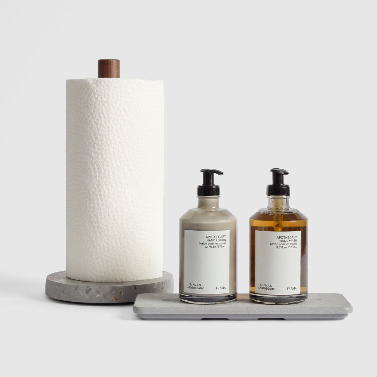 Basalt Paper Towel Holder and Ash Stone Sink Caddy on white background.