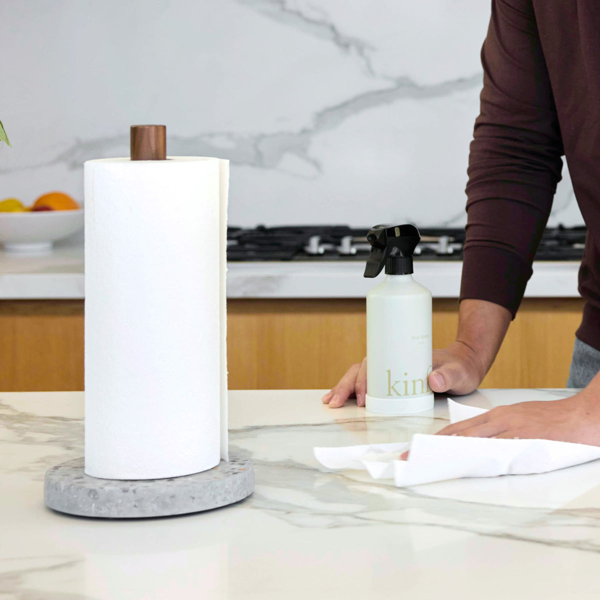 Basalt Paper Towel Holder wiping up liquid in beautiful kitchen.