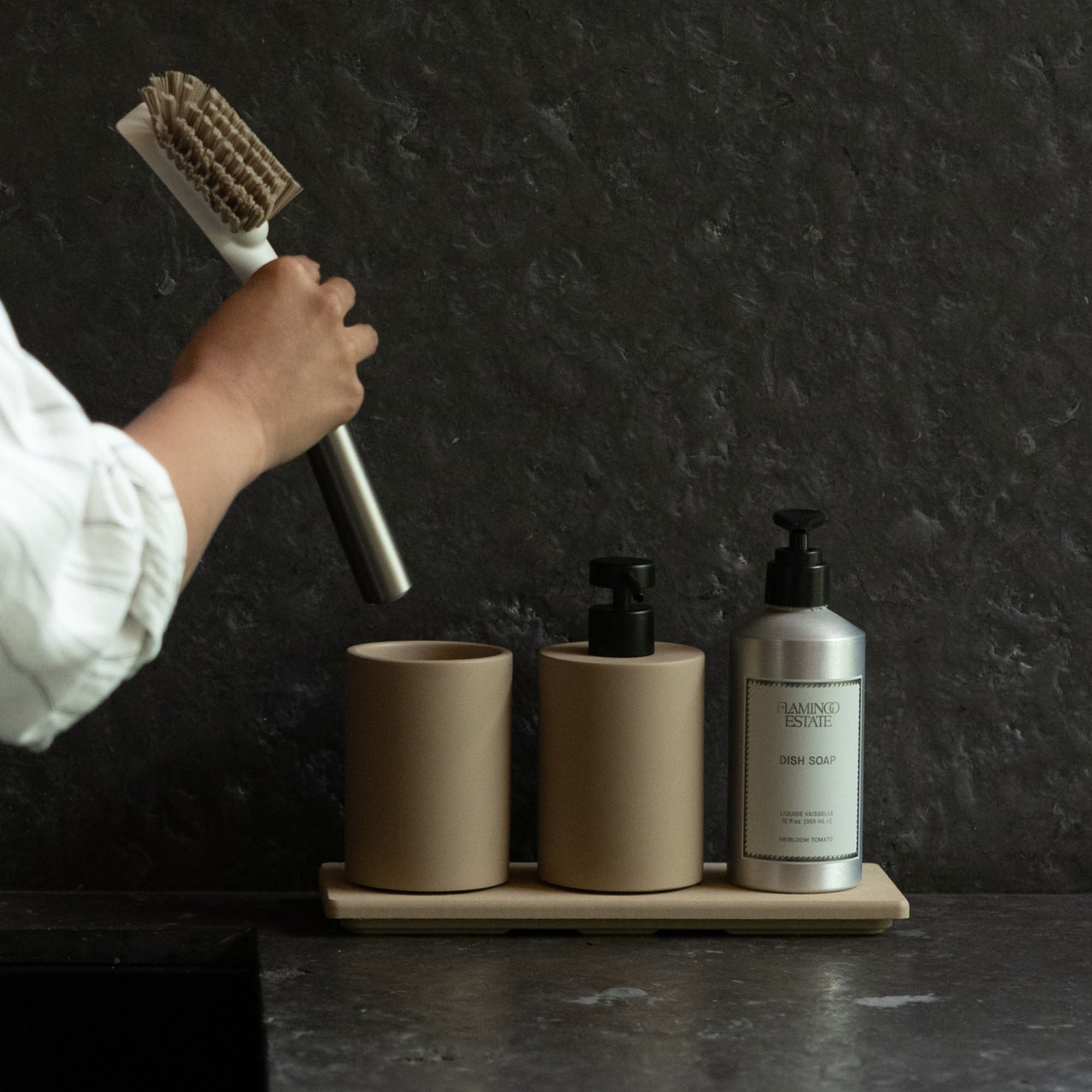 Modern Stone Sink Set in Taupe and Clay with large dish brush being added to concrete brush holder.