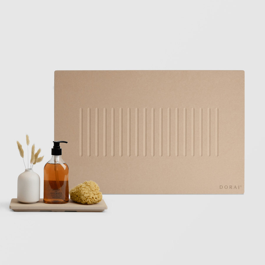 Clay Aspen Bath Stone Mat and Clay Stone Sink Caddy on white background. | Clay Collection Image