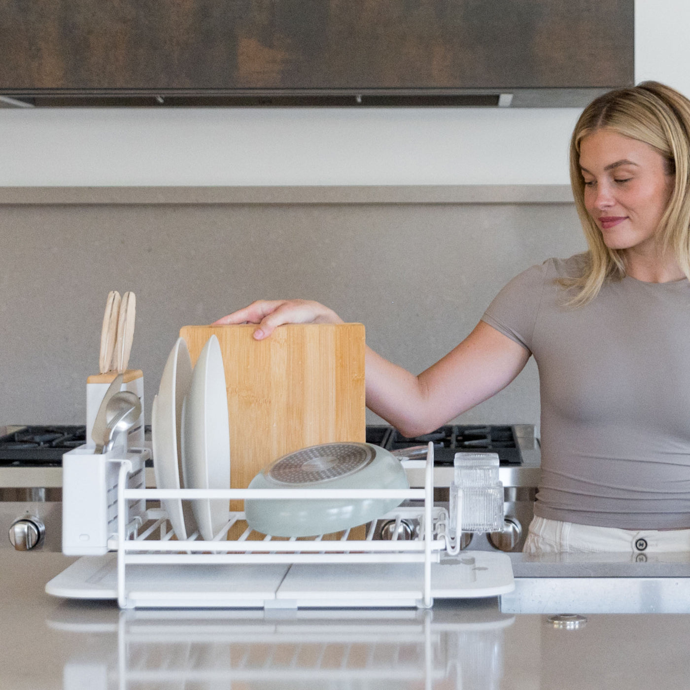Glacier Dish Rack with lots of dishes being put away. 