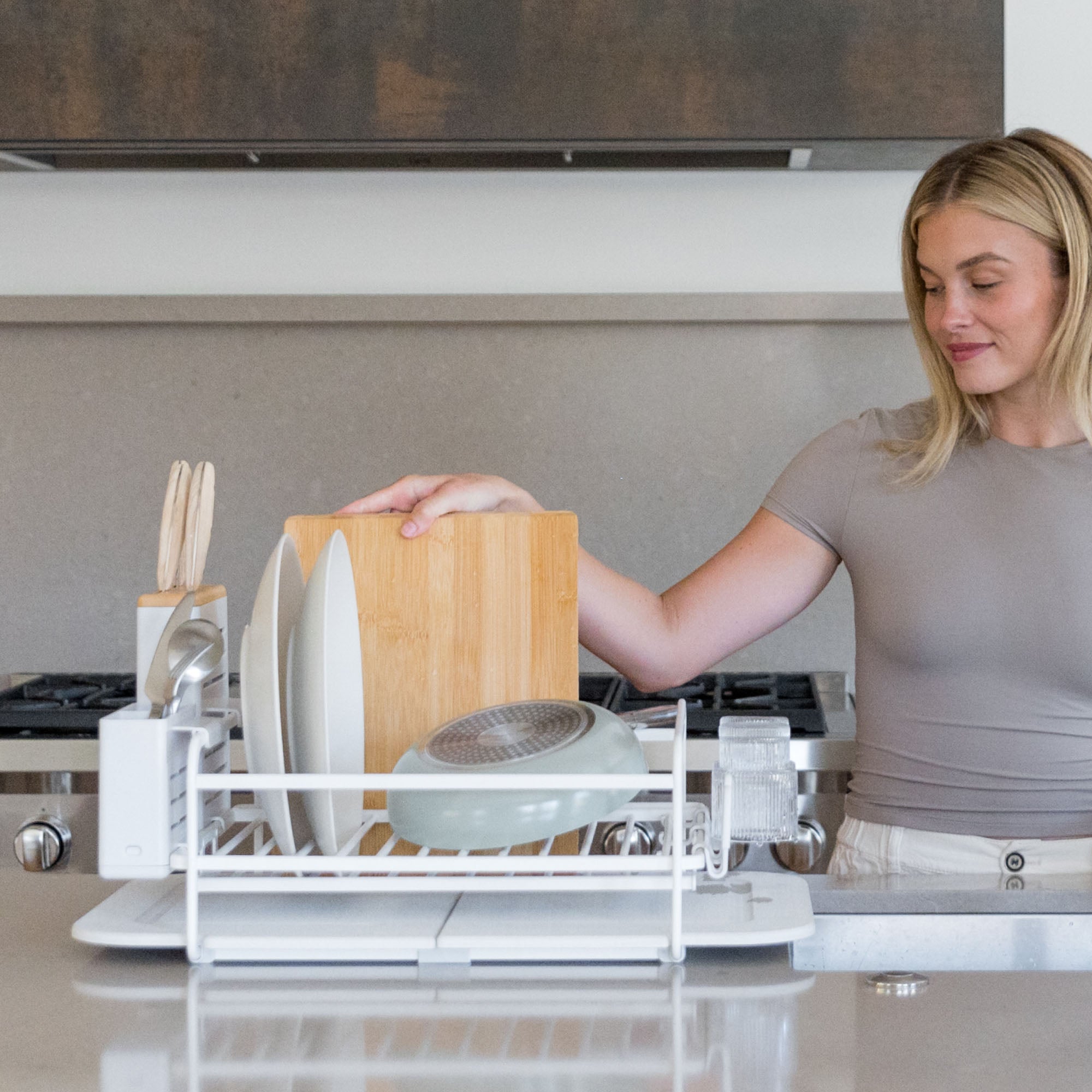 Glacier Dish Rack with lots of dishes being put away. 