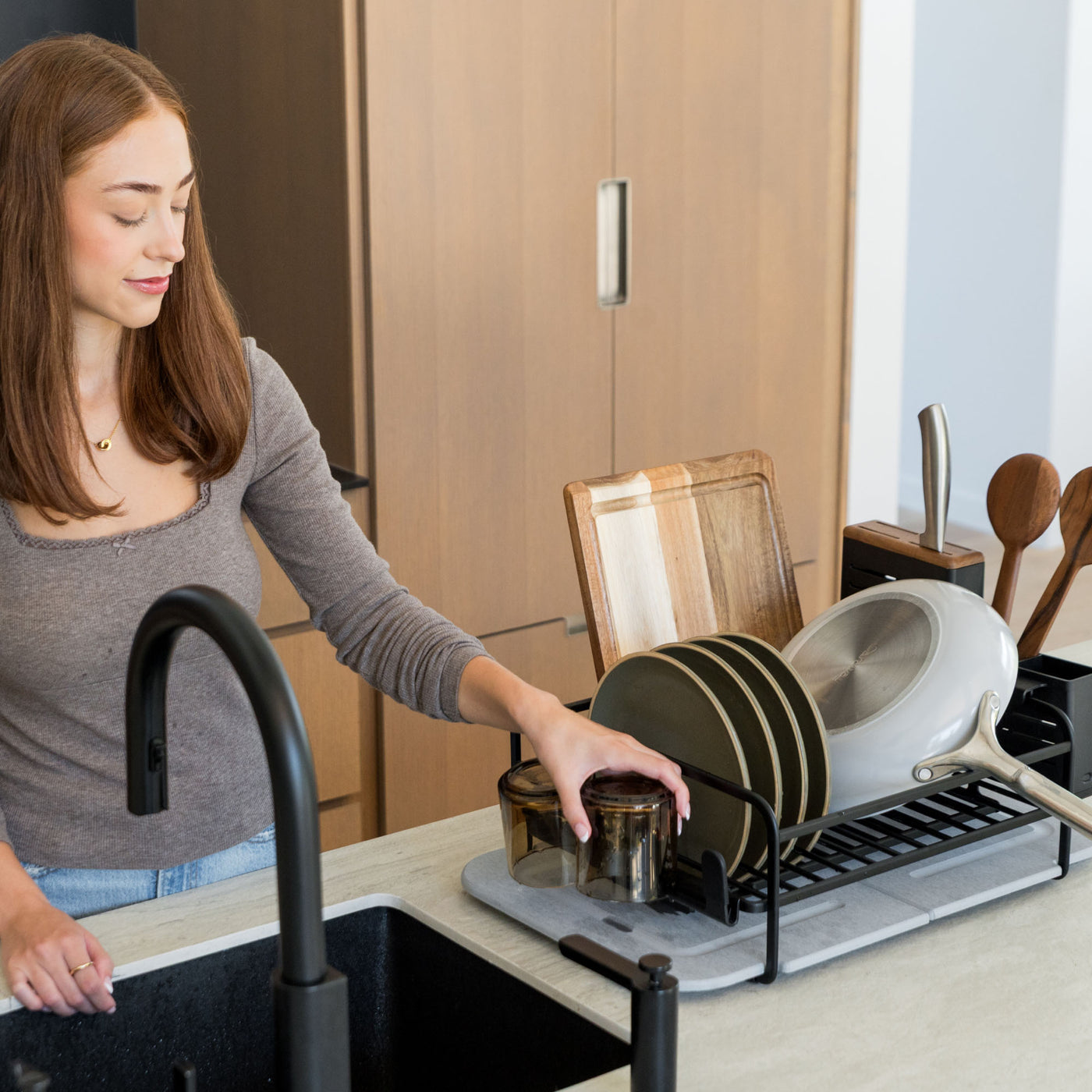 Modern kitchen with large capacity basalt dish rack. 