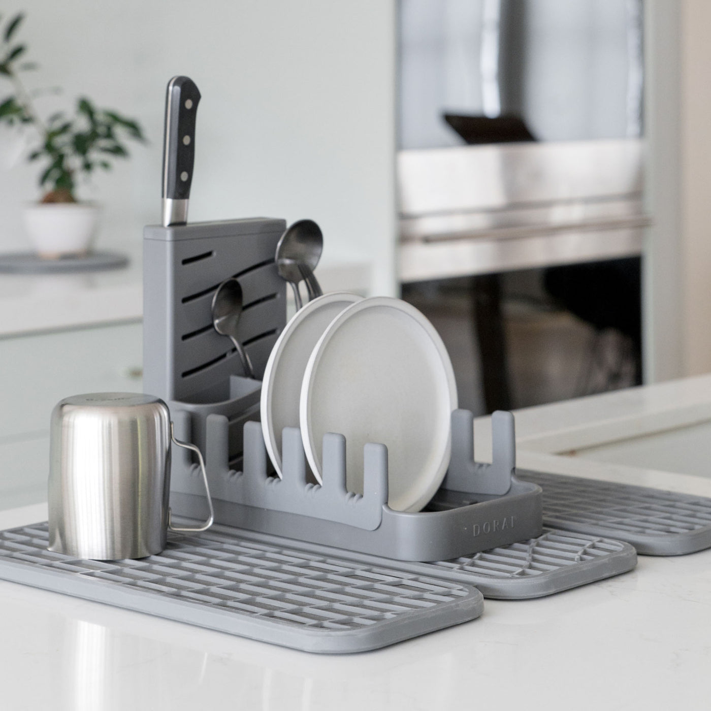 Slate Dish Pad Rack on Dish Pad with plates and utensils.