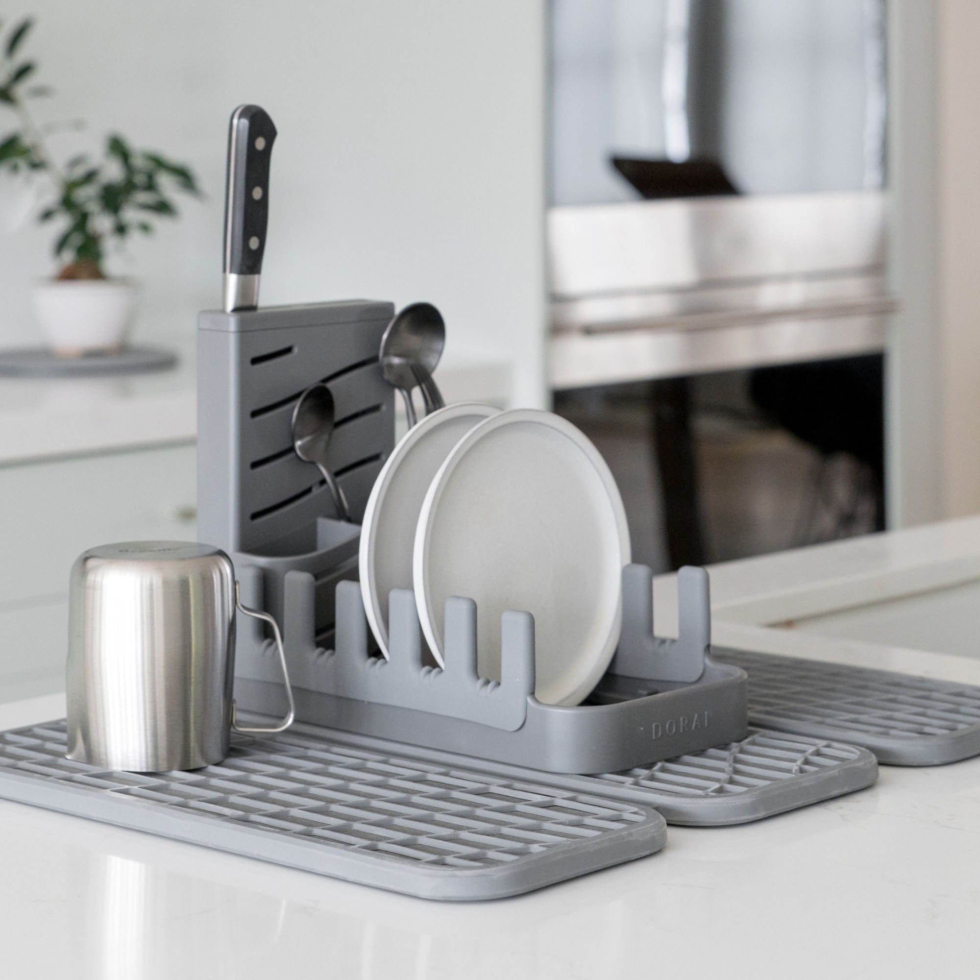 Slate Dish Pad Rack on Dish Pad with plates and utensils.