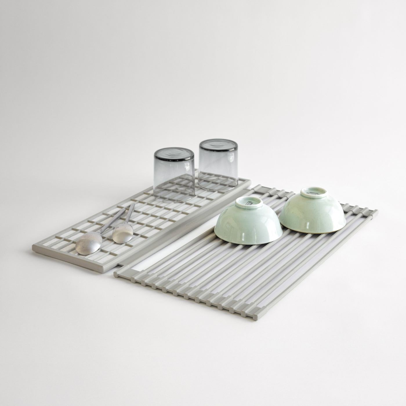 Over the Sink Dish Pad with dishes on it on a white background