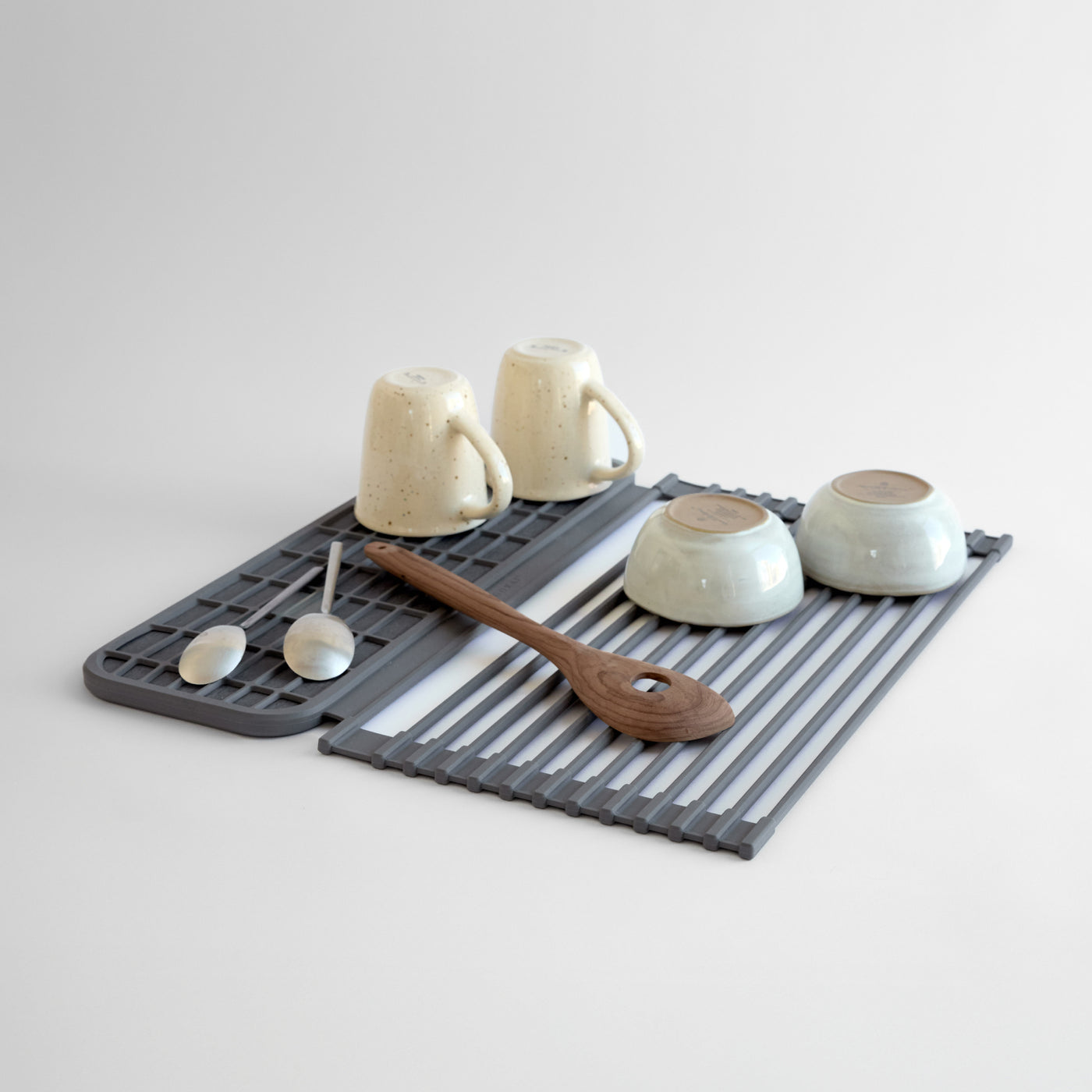 Over the Sink Dish Pad with dishes on it on a white background