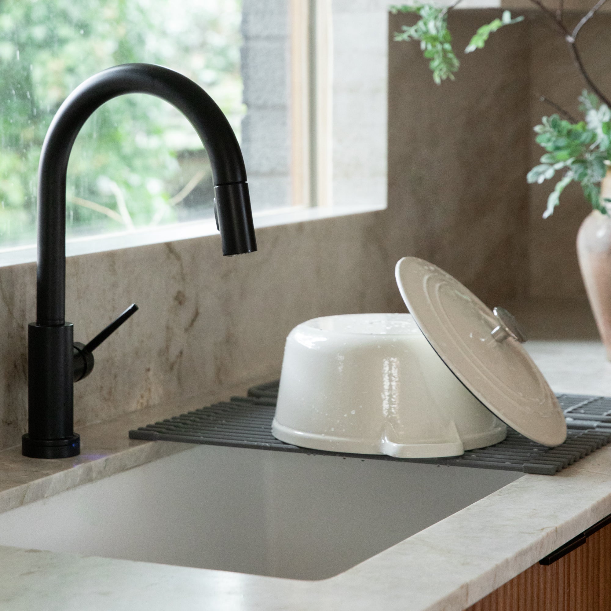 Large, heavy pot drying on an over the sink dish pad