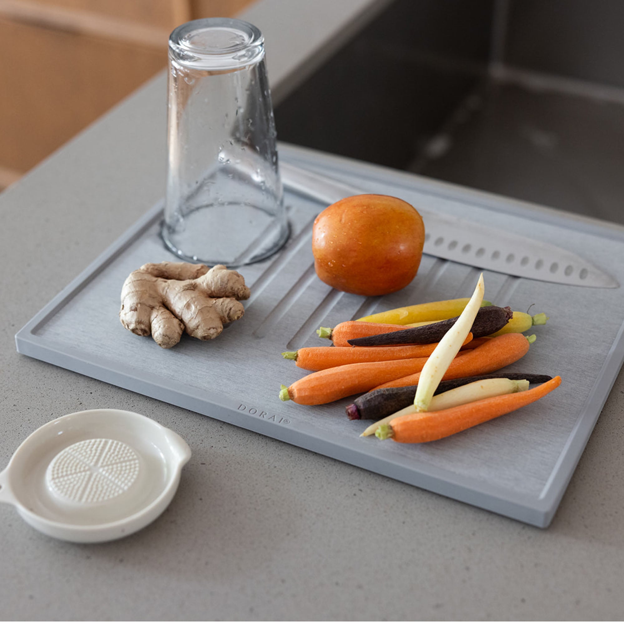 Slate quick-drying dish stone with carrots and glasses for modern kitchen. 