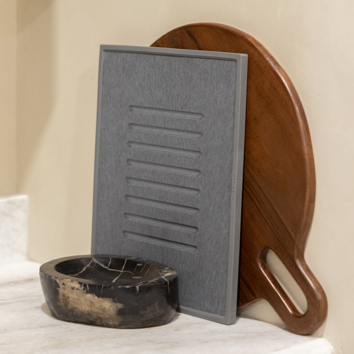 grey dish drying stone being stored 