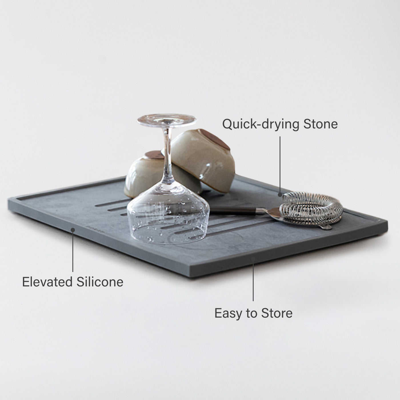 dish drying stone with wine glasses, bowls  and other items on a white background