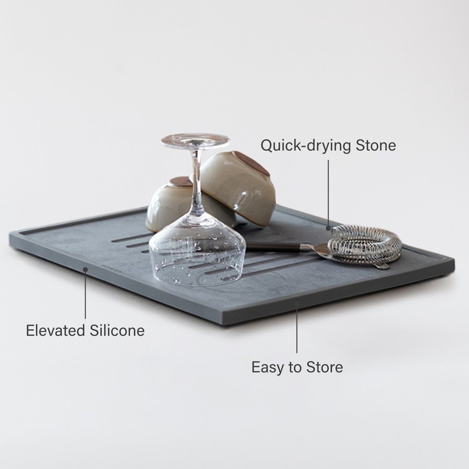 dish drying stone with wine glasses, bowls  and other items on a white background