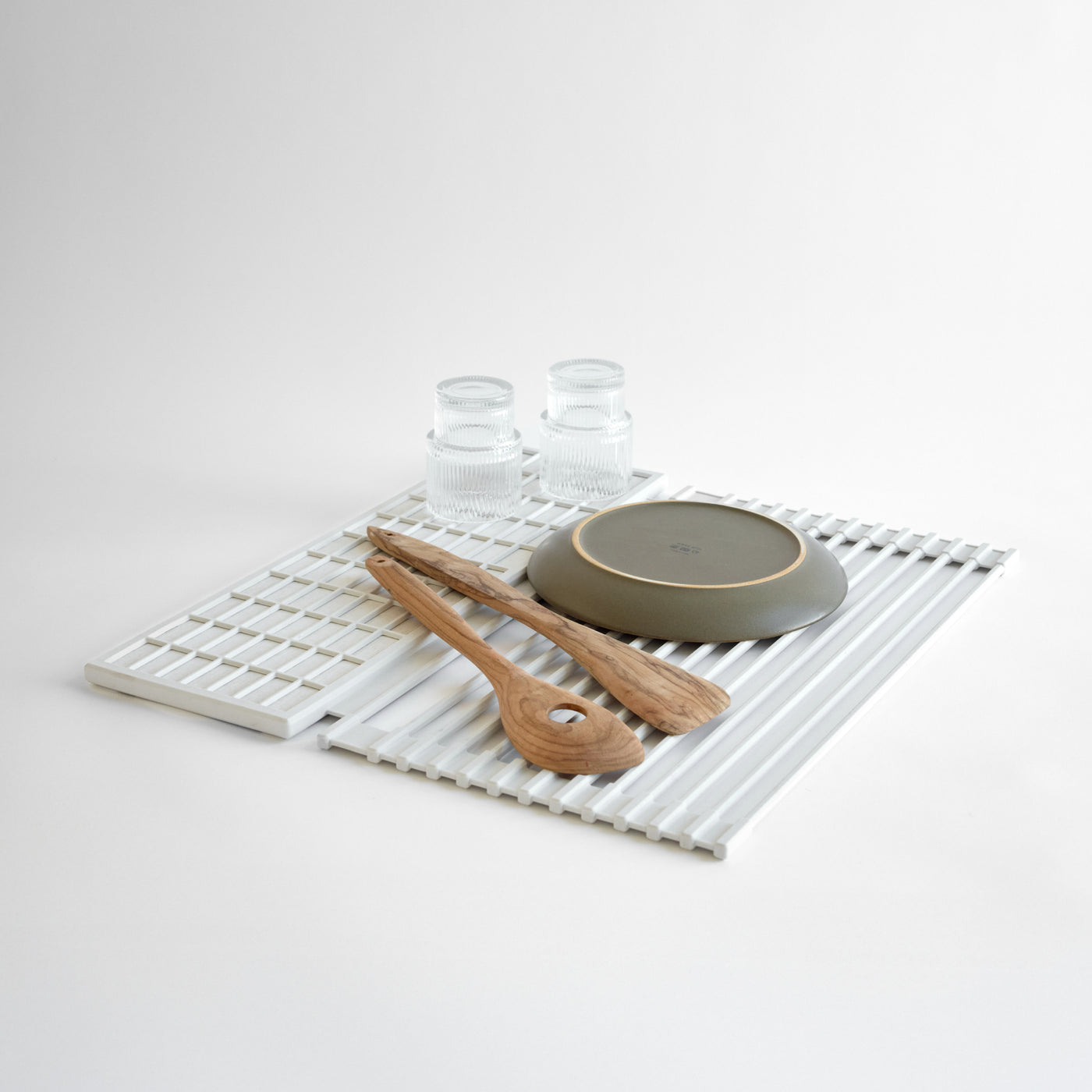 Over the Sink Dish Pad with dishes on it on a white background