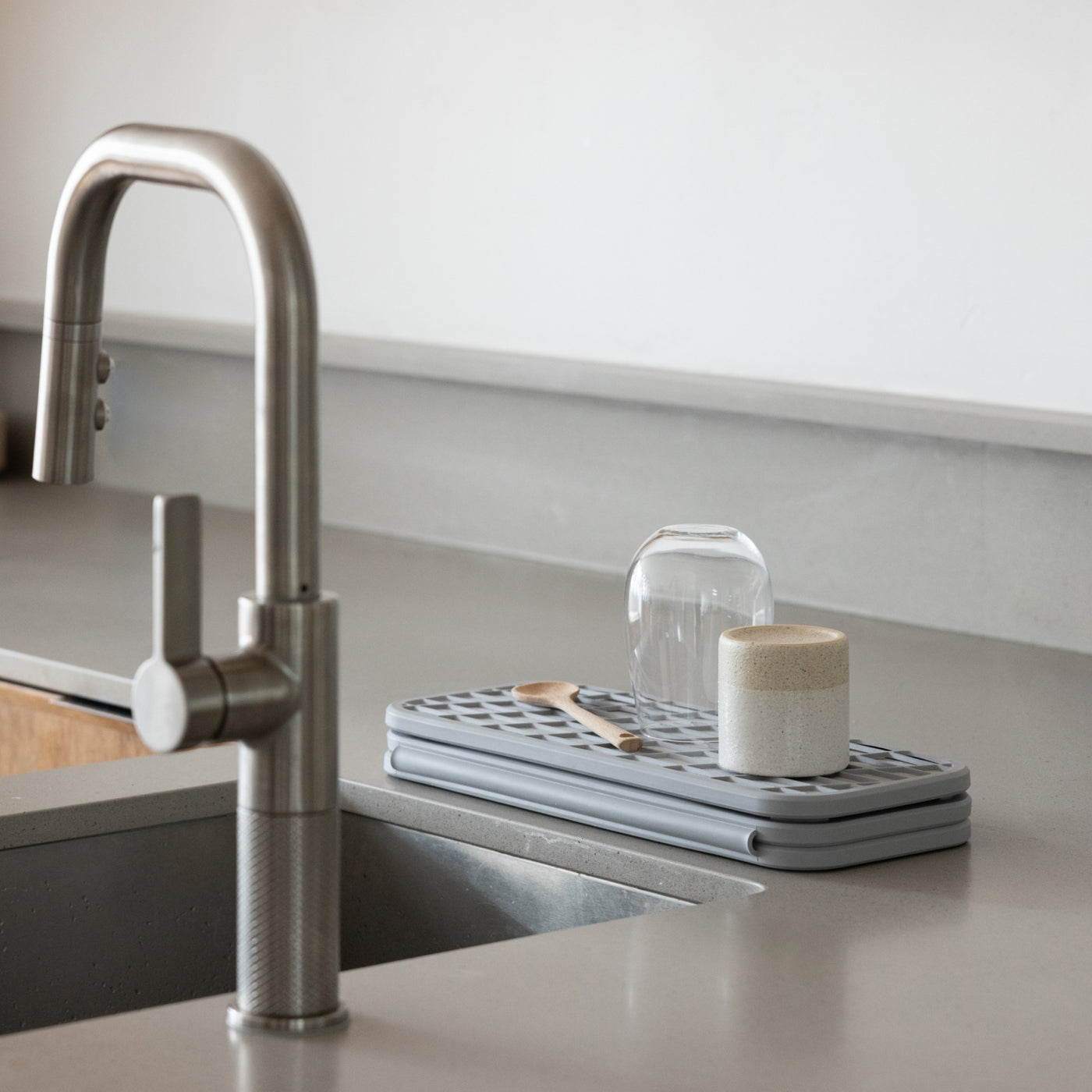 folded dish drying stone on kitchen counter
