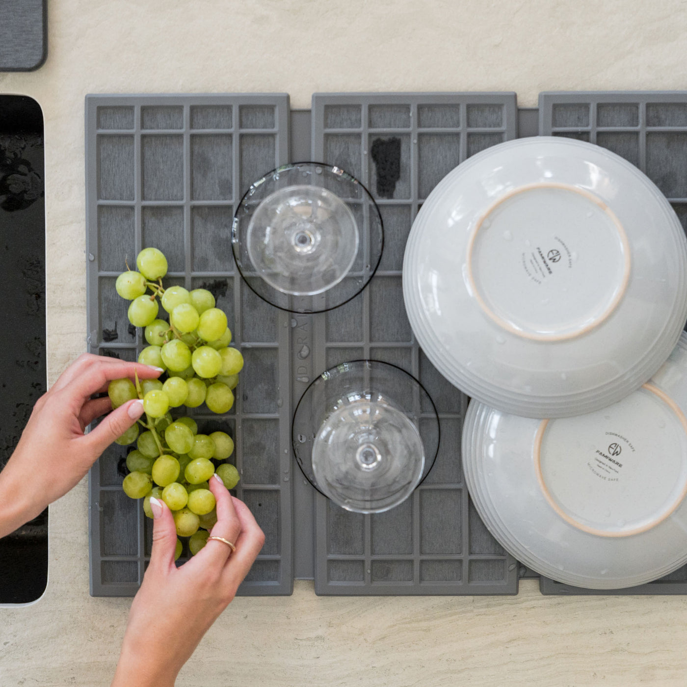 Slate Ridge Dish Pad with plates and produce is quick-drying.