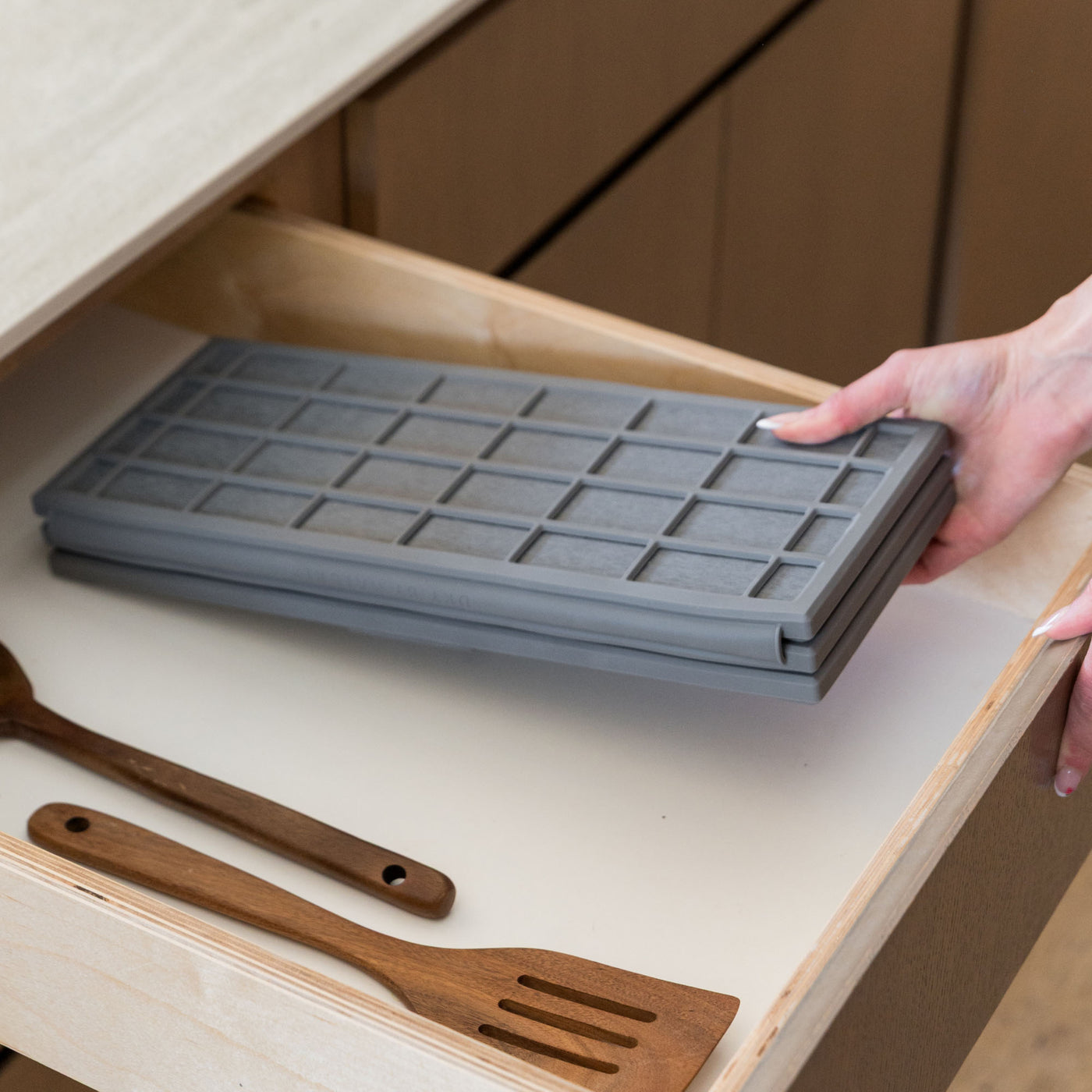 Ridge Dish Pad in Slate folds up when not in use.