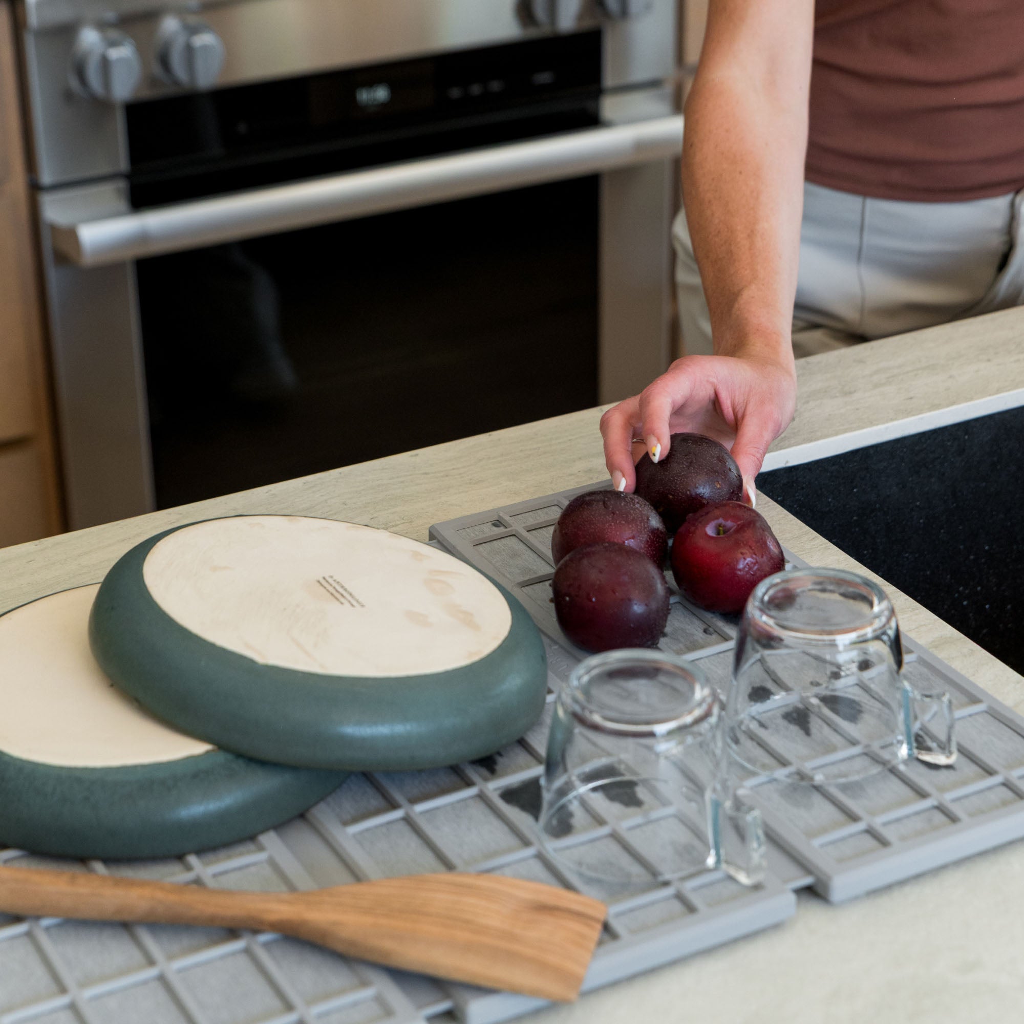 Ash Ridge Dish Pad with plates and produce.