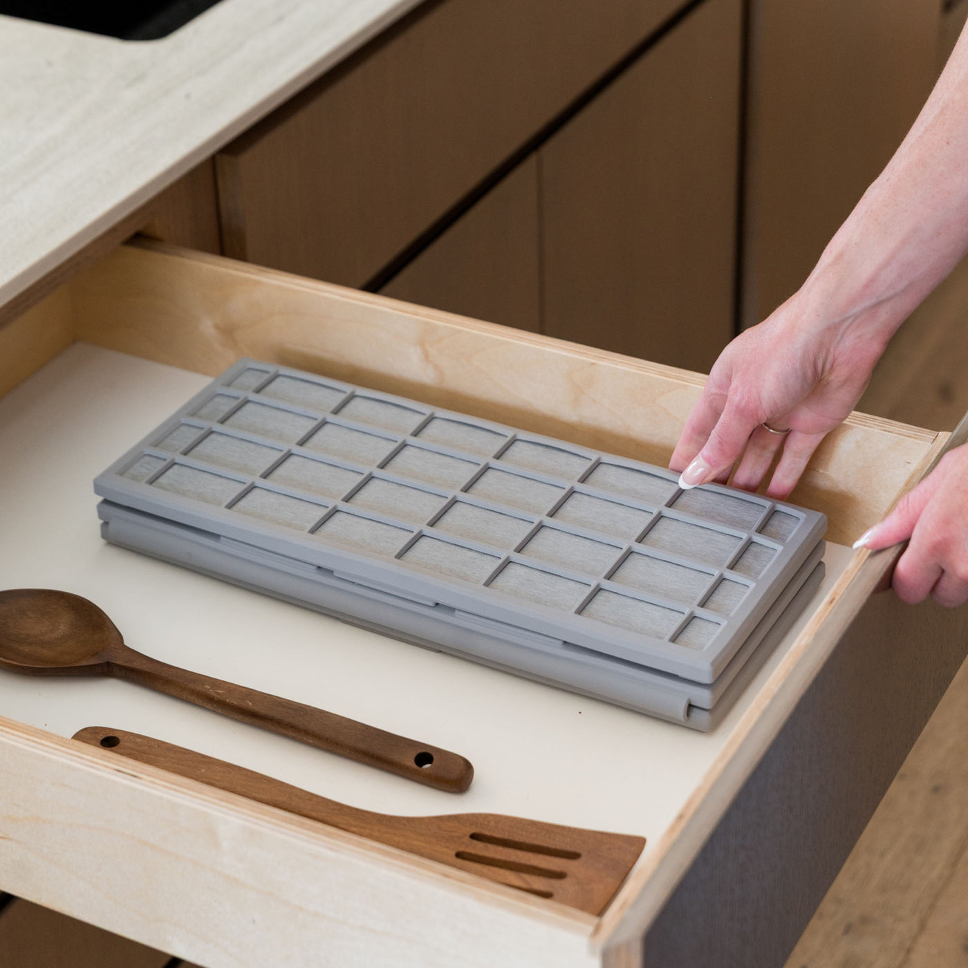 Ridge Dish Pad in Ash folds neatly in drawer.