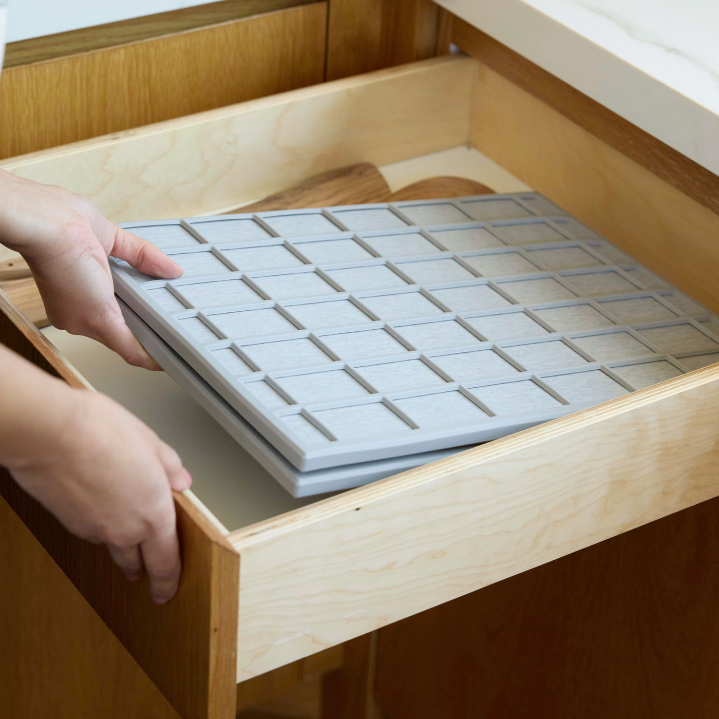 Ridge Large Dish Pad folded in half tucks neatly in kitchen drawer.