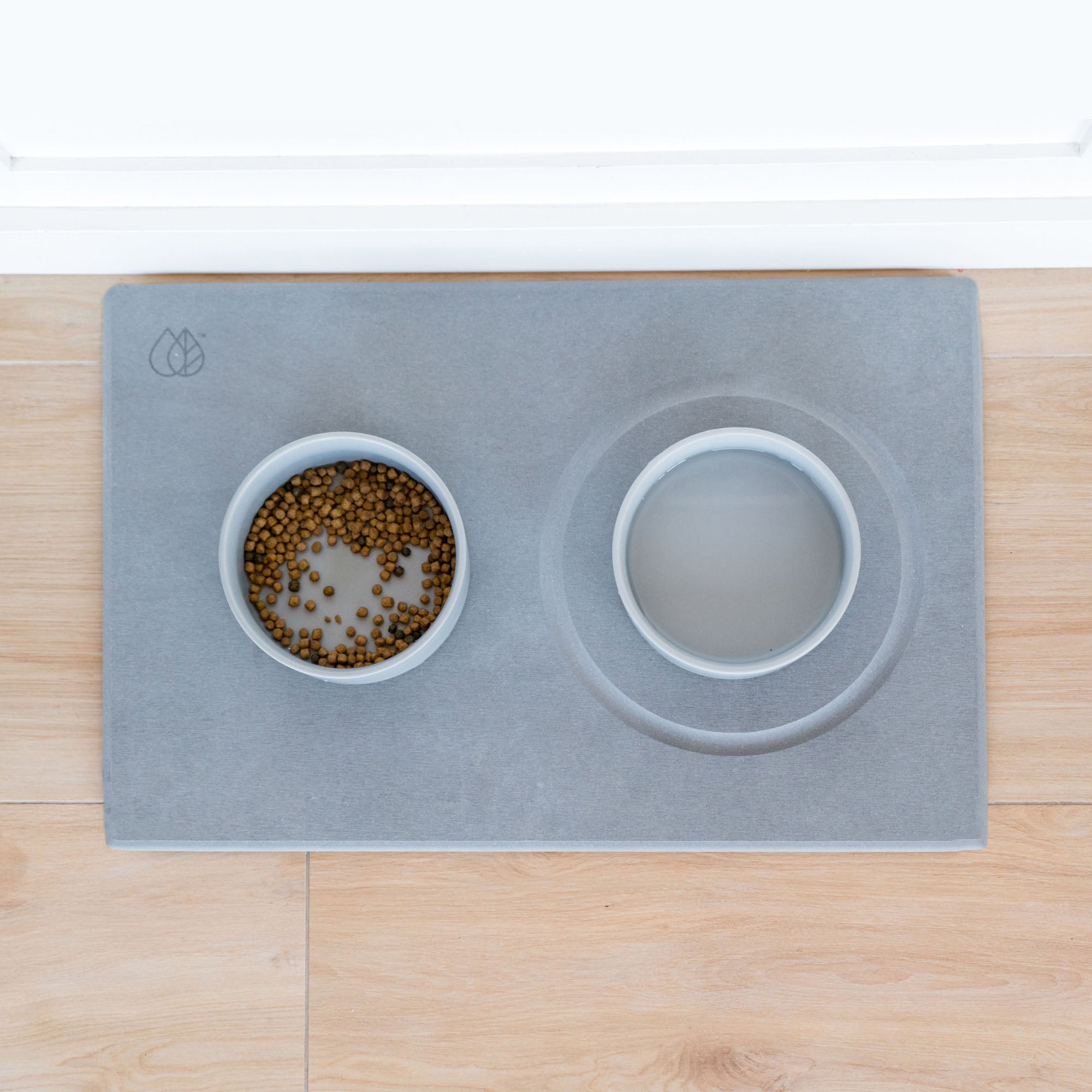 Stone Base for dogs with water and food bowls and gutter for water bowl. 