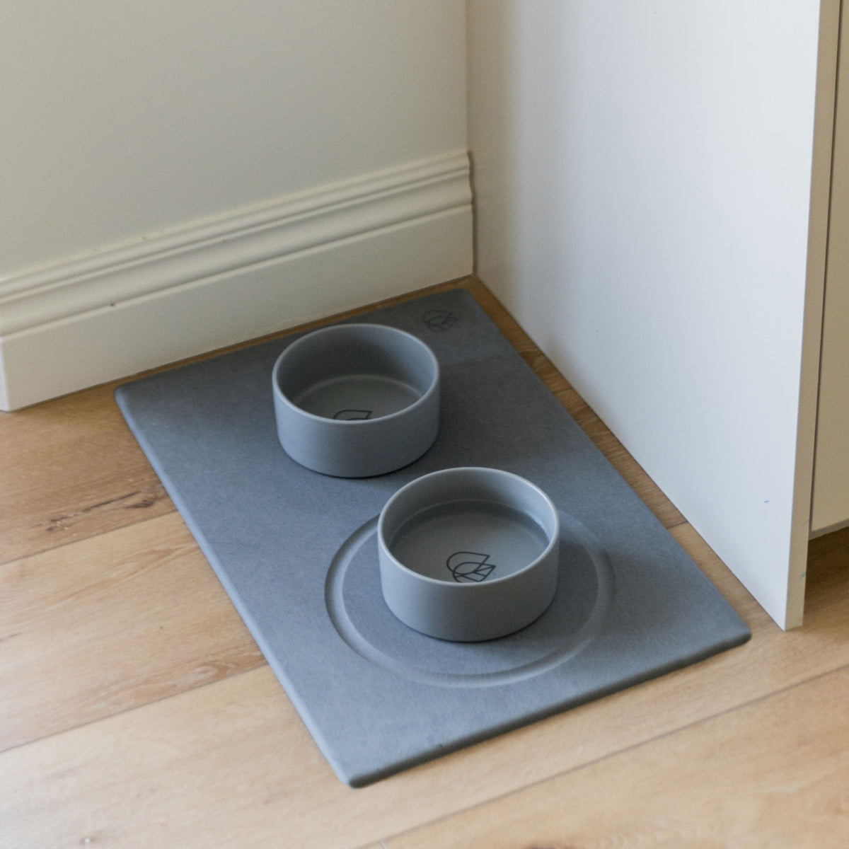Two Dorai Ceramic Dog Bowls on stone mat. 