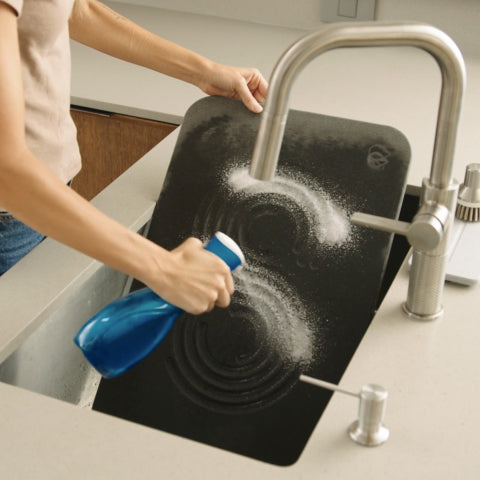Wet stone and spray with soap