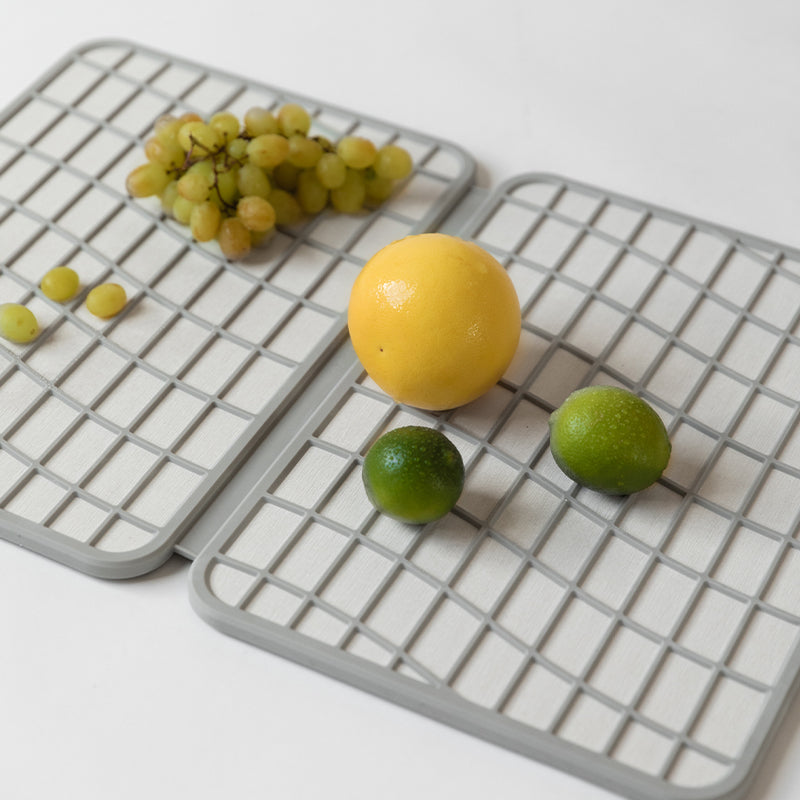 lemons and limes drying on dish pad