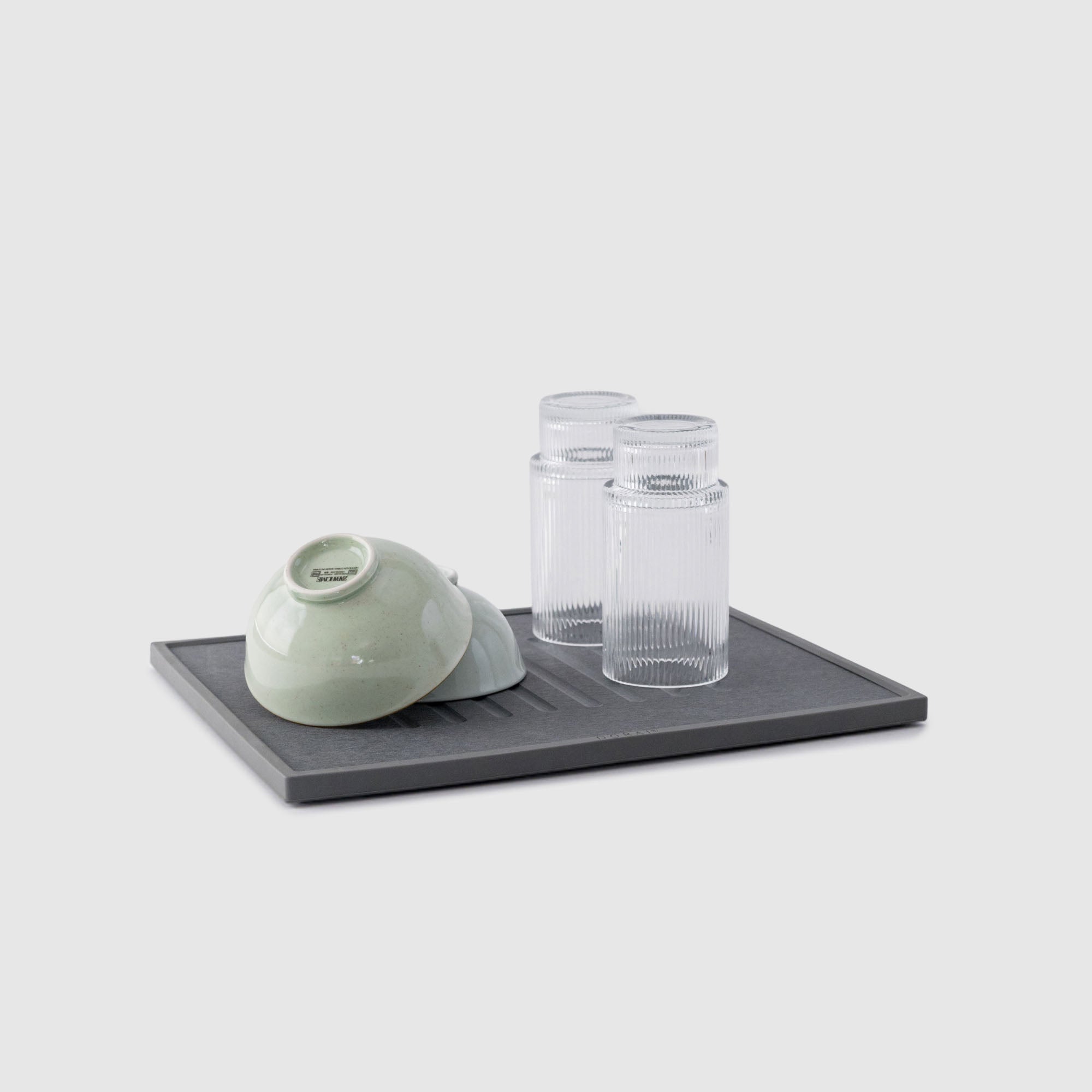 Slate dish drying stone with dishes. 