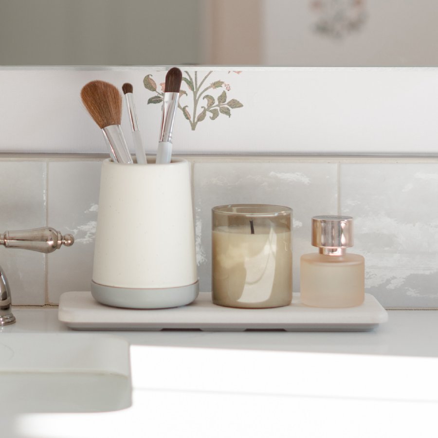 bathroom sink with sink caddy and brush holder for makeup brushes