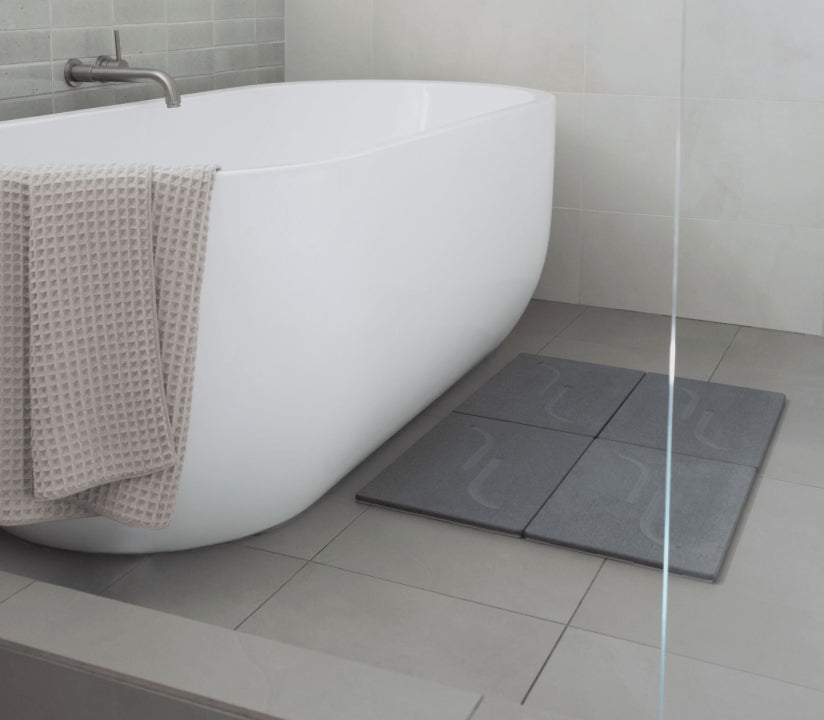Quick-drying in large bath stone in beautiful, modern bathroom. 