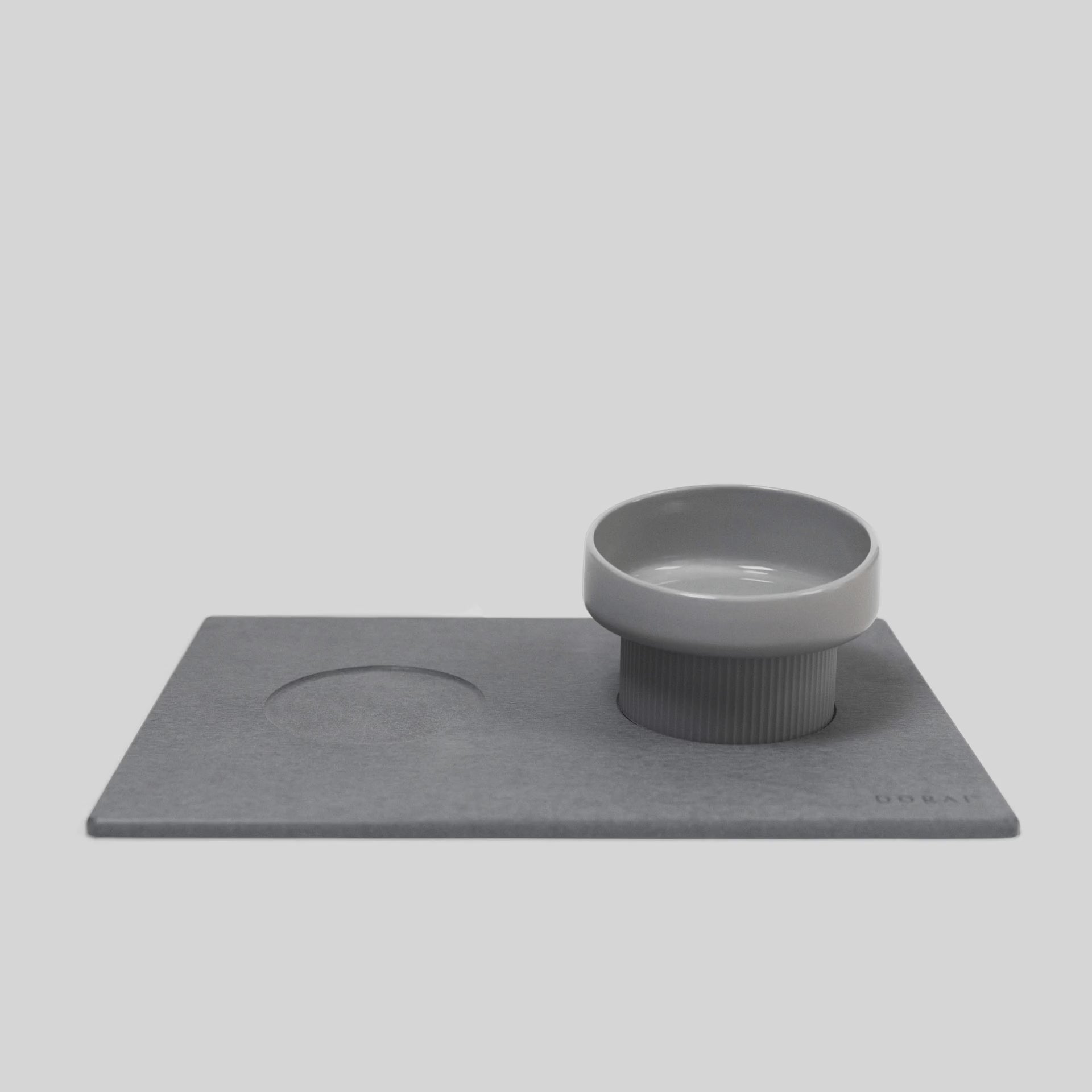 Elevated Cat Feeding Station keeps bowls off of the mat. 