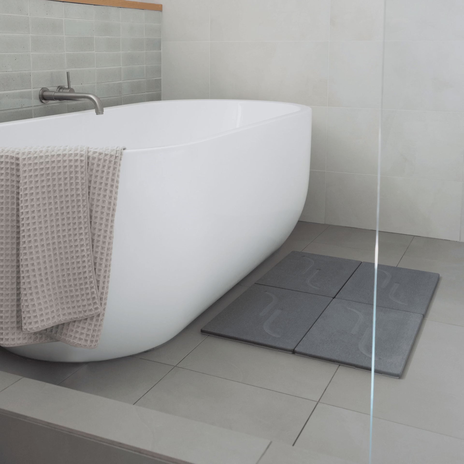 Large arch bath stone in slate with customizable layout. 