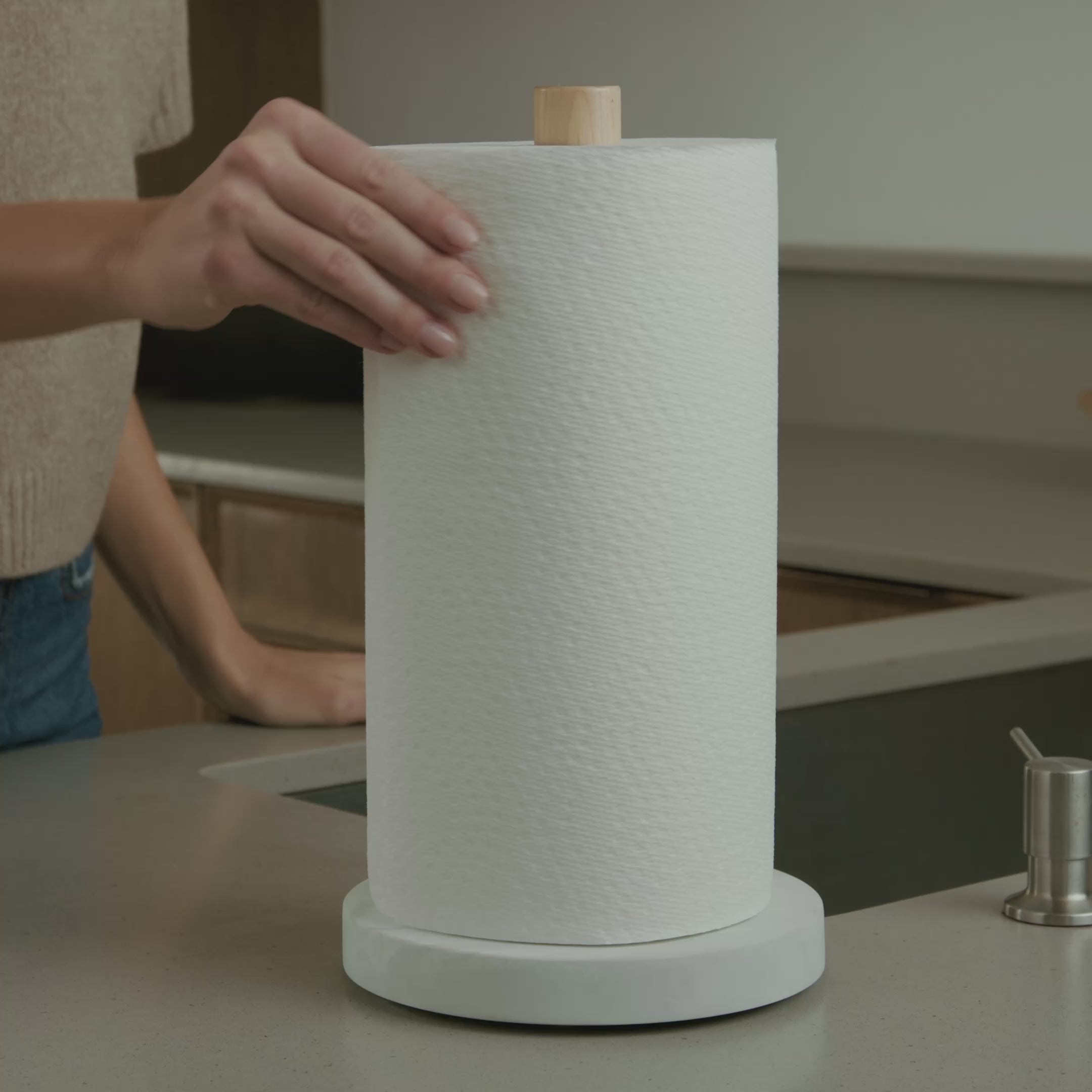non-slip paper towel holder being used in kitchen for one handed tear